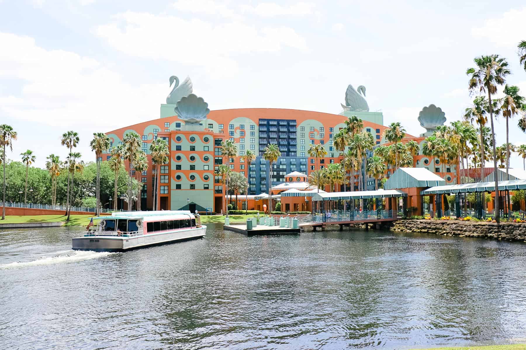 A Friendship boat pulling up to the dock.