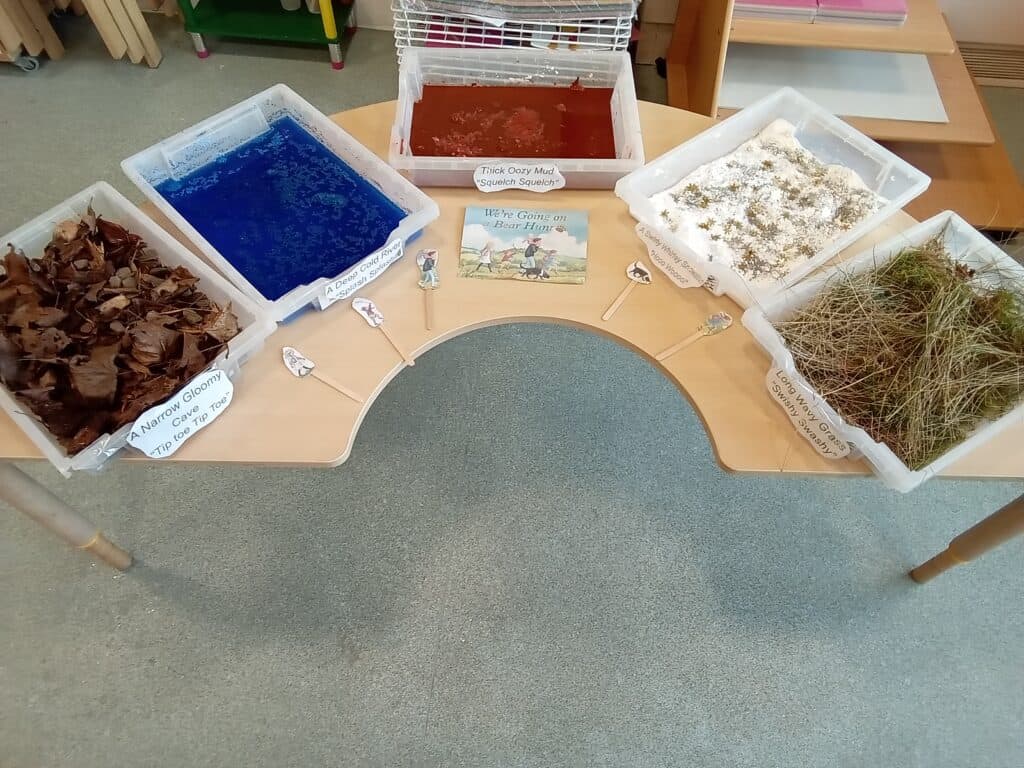 Colourful sensory play bins with natural and textured materials for early childhood development, learning, and exploration at Thrive Childcare.