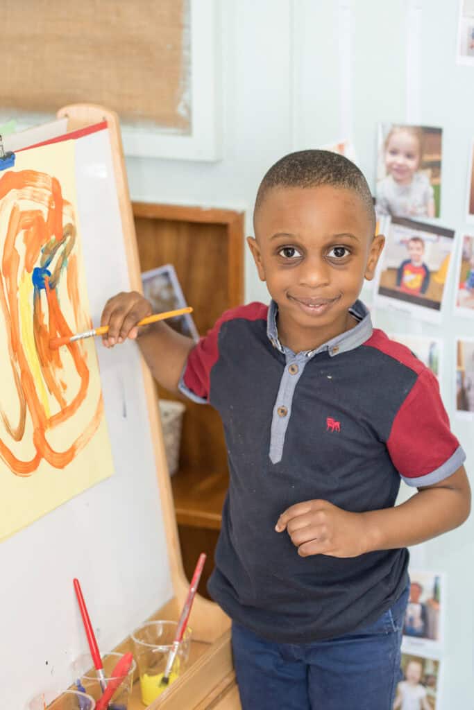Bright young child completing creative painting activity at Thrive Childcare, a trusted early childhood education provider promoting developmental skills and colourful learning experience.