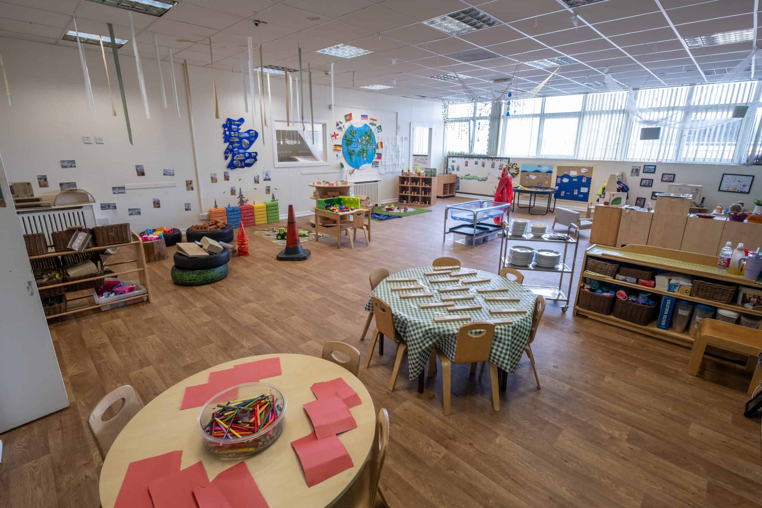 Bright childcare classroom at Thrive Childcare with play areas, educational materials, and activity zones designed for early childhood development and learning.
