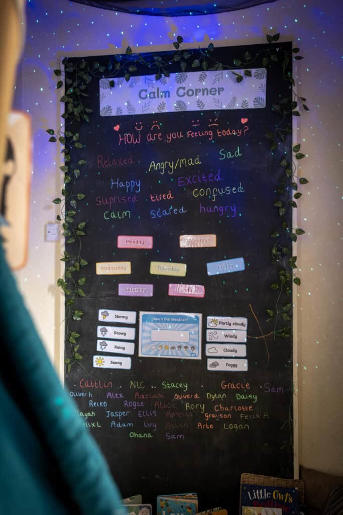 Calm Corner chalkboard at Thrive Childcare with children’s emotions, weather, and daily schedule displays, creating a comforting environment for young children to express and manage feelings.