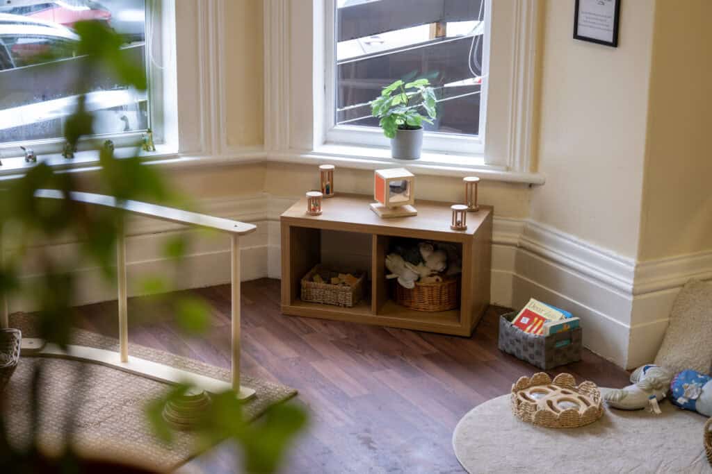 Bright and welcoming corner of Thrive Childcare featuring soft play area, educational toys, and cosy seating, designed for early childhood development and age-appropriate learning spaces.