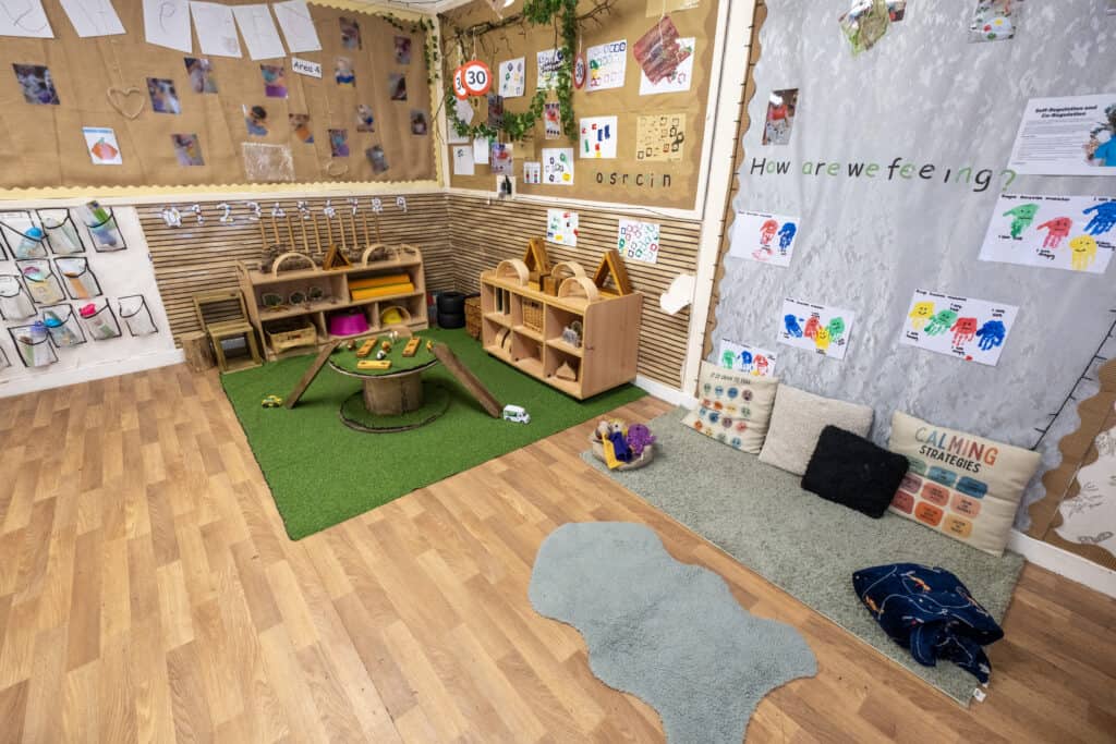 Bright, engaging early childhood classroom at Thrive Childcare featuring colourful educational displays, sensory play area, and cozy reading corner, designed to support child development and learning.
