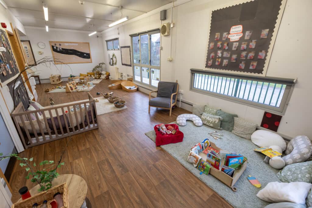 Bright childcare indoor playroom with toys, books, and age-appropriate furniture at Thrive Childcare. Ideal for early childhood development and learning in a safe, nurturing environment.