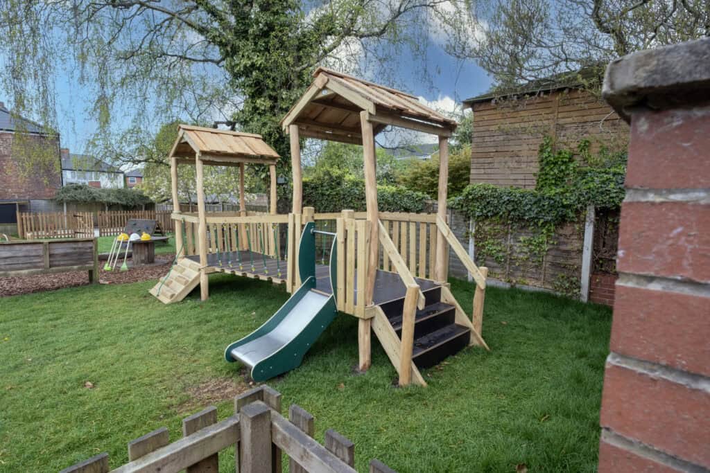 1. Colourful outdoor children’s playground with slides and climbing areas at Thrive Childcare, designed to promote active play and sensory development in a safe environment.