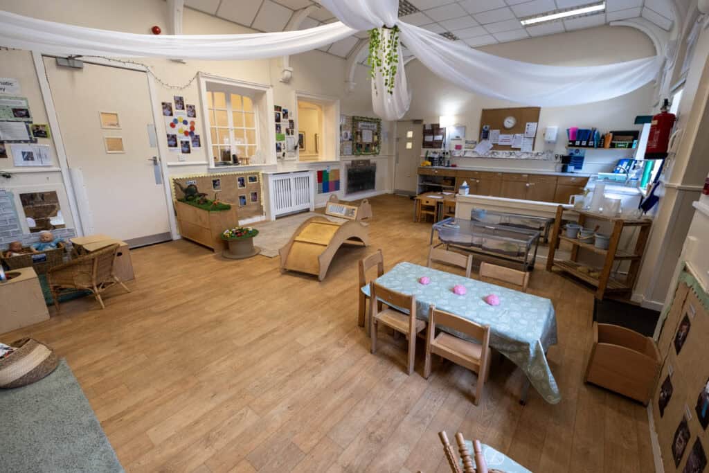 Bright, welcoming childcare classroom at Thrive Childcare featuring age-appropriate toys, educational displays, and a safe play environment for young children.