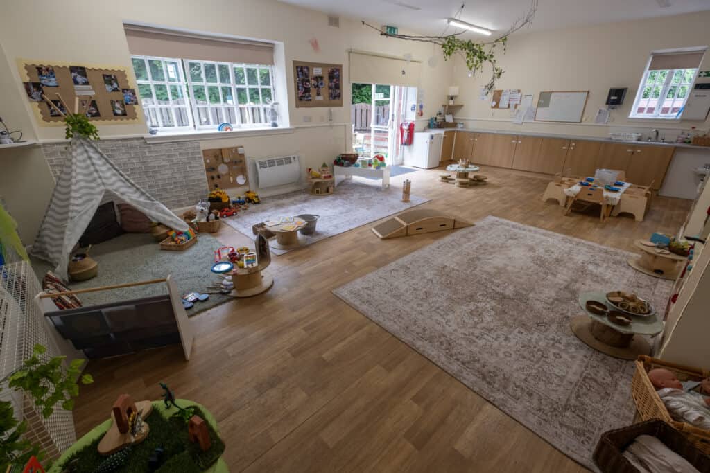 Bright and spacious early childhood learning environment at Thrive Childcare with colourful toys, play zones, and comfortable seating for nurturing children's development.