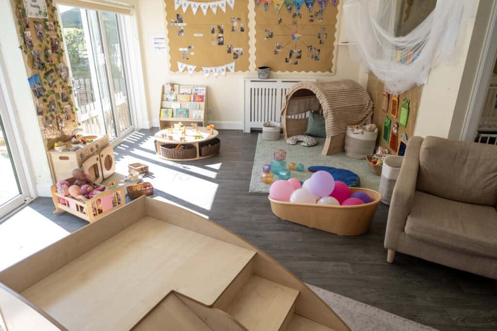 1. Bright and welcoming nursery play area with toys, books, and cozy reading nook, designed for safe, enriching childcare and early childhood development.