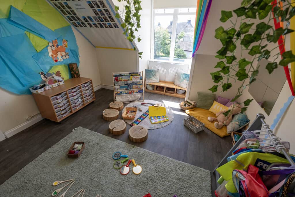 Colourful nursery playroom with toys, reading corner, and natural light, highlighting childcare environment, early childhood development, and safe spaces for children at Thrive Childcare.