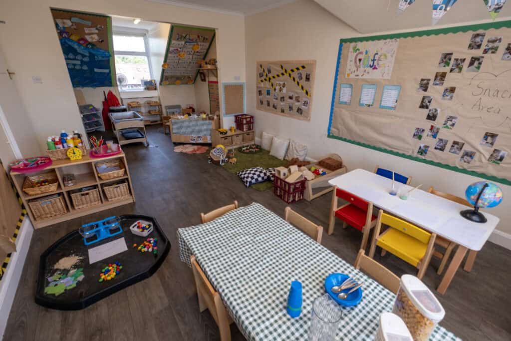Bright and welcoming childcare indoor play area at Thrive Childcare, featuring educational toys, arts and crafts, snack zone, and children’s tables, ideal for early childhood development and fun learning activities.
