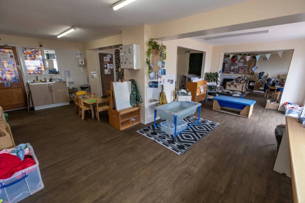 Bright indoor childcare space at Thrive Childcare with learning areas, play zones, and activity stations for children’s development and early education.
