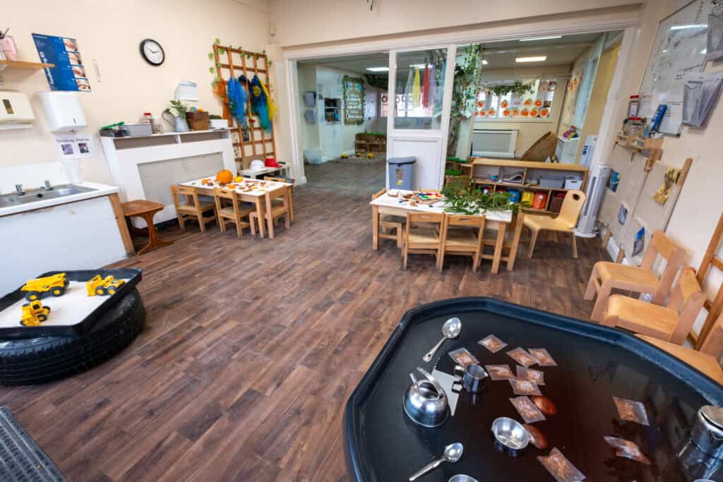 1. Bright, inviting early childhood learning and play area at Thrive Childcare with child-sized tables, educational toys, and creative activities for young children.