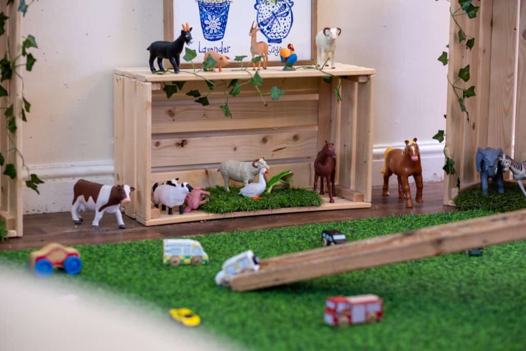 Tiny farm animal toys display in a preschool setting at Thrive Childcare, creating a fun, educational environment for children to learn about animals and nature.
