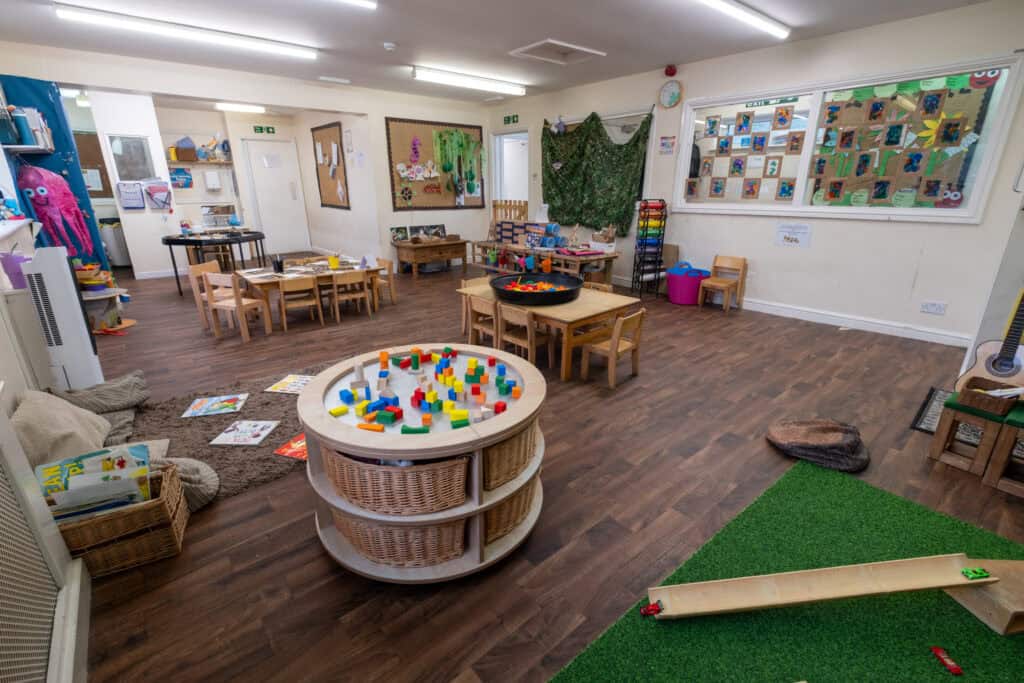 Bright and inviting childcare room at Thrive Childcare showcasing engaging play areas and educational materials for early childhood development.