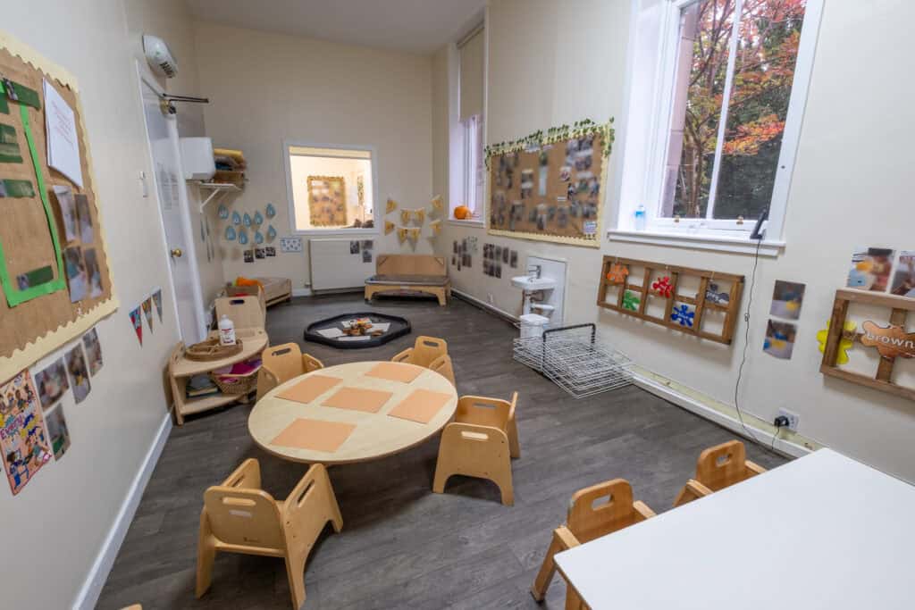 Bright and welcoming early childhood education classroom at Thrive Childcare, featuring colourful displays, child-sized furniture, and engaging learning areas for preschool children.