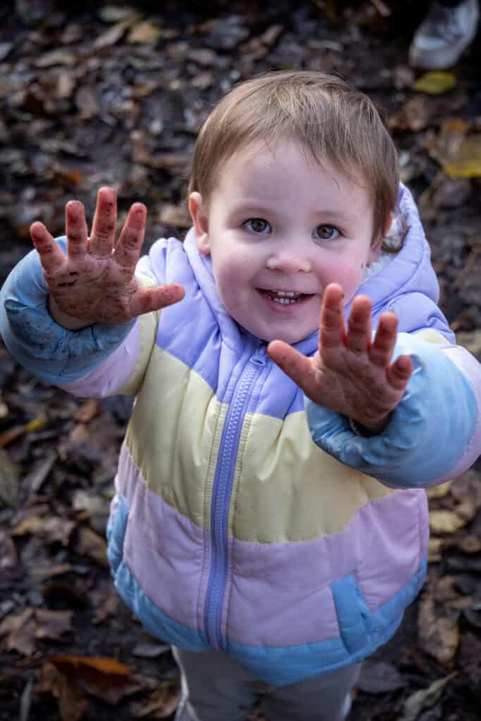 Playing outdoors with children at Thrive Childcare, emphasising fun, discovery, and nature-based learning in a safe and nurturing environment.