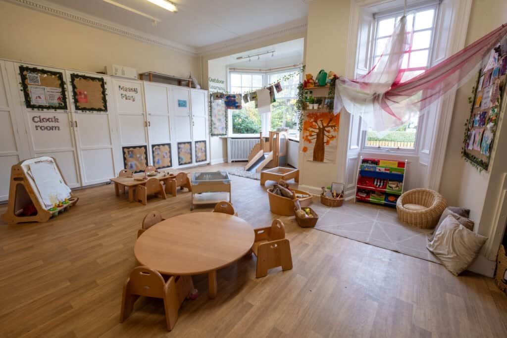 Bright and welcoming Thrive Childcare indoor play area with natural light, age-appropriate toys, and educational resources for early childhood development.