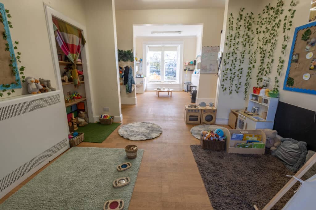 Bright, safe indoor childcare play area at Thrive Childcare featuring engaging toys, colourful decor, and a welcoming environment for early childhood development and learning.