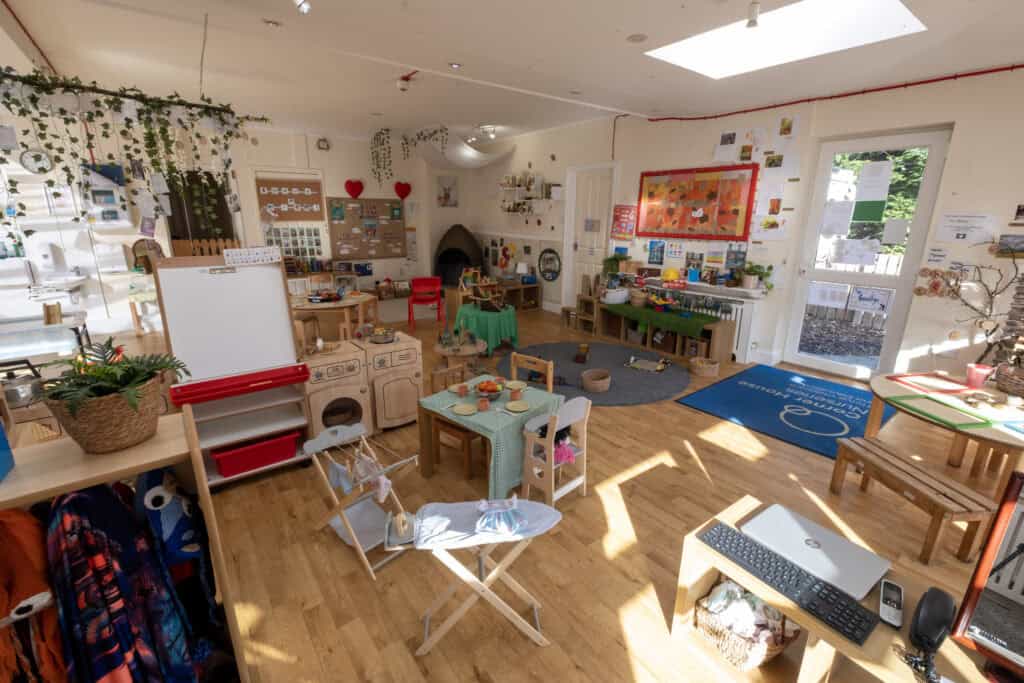 Bright and welcoming indoor play area at Thrive Childcare with educational toys, art displays, and cosy activity zones, ideal for early childhood development and learning.