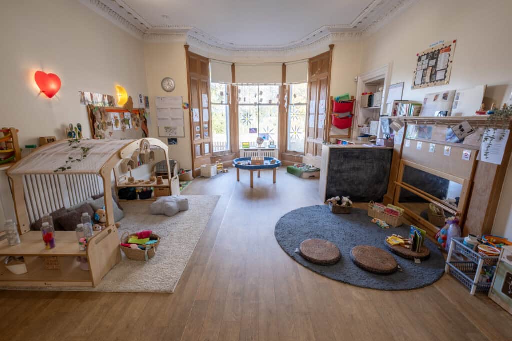 A colourful, well-organised childcare classroom at Thrive Childcare, featuring cozy learning corners, educational toys, and bright decor to support early childhood development and imaginative play.