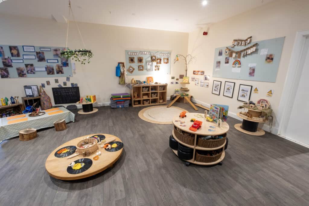 Bright, welcoming childcare playroom with age-appropriate toys, learning areas, and colourful décor at Thrive Childcare, promoting early childhood development and engaging children's creativity.