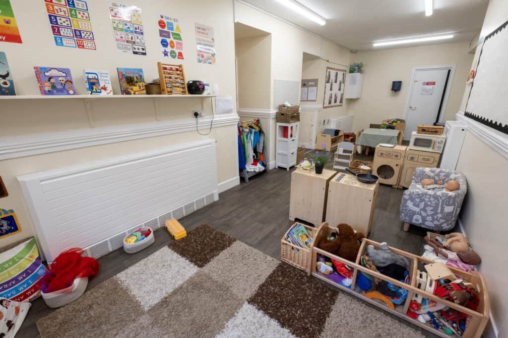 Bright and inviting Thrive Childcare play area with toys, educational materials, and child-friendly furniture for early childhood development and learning.