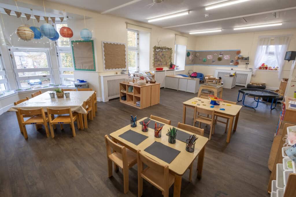 Soft play area in Thrive Childcare with colourful decorations, child-friendly furniture, and learning stations for early childhood development and imaginative play.
