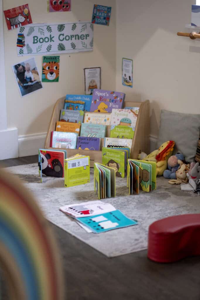 Board Corner with colourful children's books, promoting early literacy and engagement, in a welcoming childcare environment focused on learning and development in line with Thrive Childcare.
