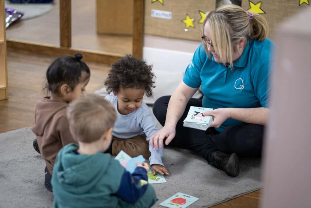 Brightly coloured educational cards used during early childhood learning activities at Thrive Childcare, promoting development and engagement for young children.