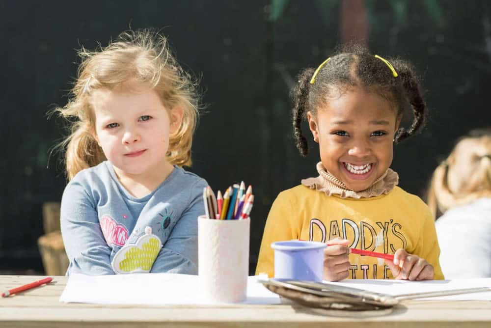 Brightly smiling children enjoying outdoor activities at Thrive Childcare, focusing on early childhood education, fun learning environments, and quality childcare services in a safe, nurturing setting.
