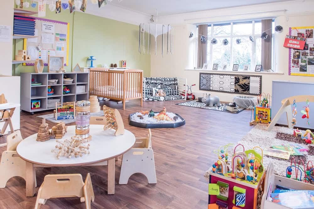 Bright indoor daycare playroom at Thrive Childcare, featuring toys, learning stations, and colourful decor for early childhood education and child development.