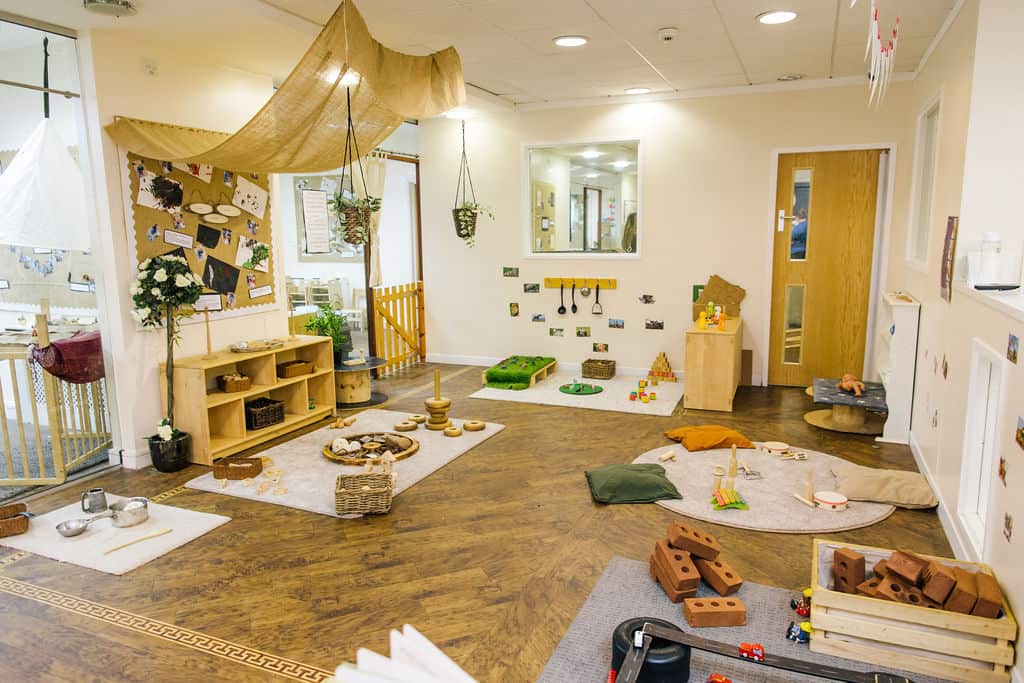 Bright, welcoming childcare play area at Thrive Childcare with soft mats, educational toys, and sensory play zones for early childhood development and preschool learning.