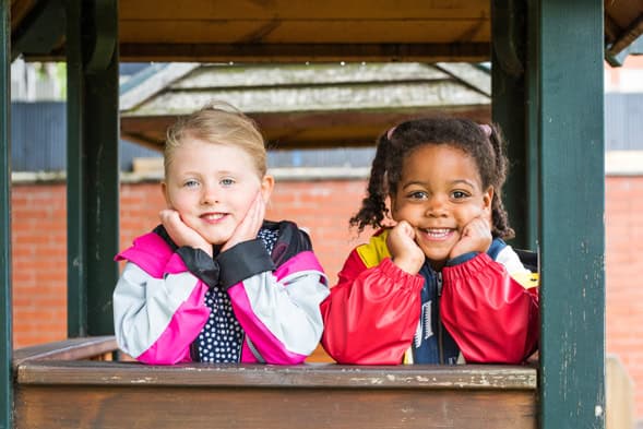 Engaging preschool children playing outdoors at Thrive Childcare, promoting fun learning environments and child development in a safe, nurturing setting.