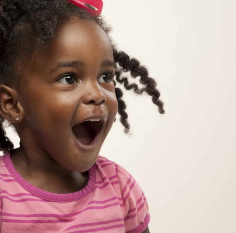Bright happy young girl at Thrive Childcare, showing joy and engagement in a safe and nurturing early childhood education environment.