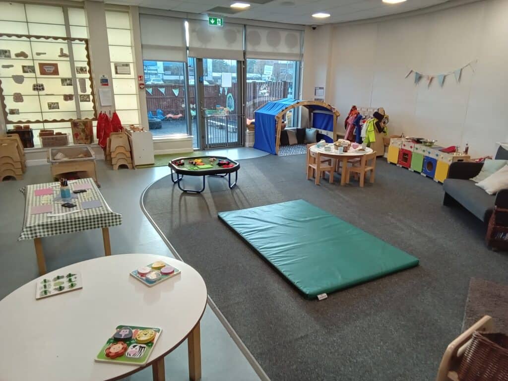 Colourful indoor play area at Thrive Childcare with age-appropriate toys and activity stations for young children. Bright, welcoming environment designed for early childhood development and fun.