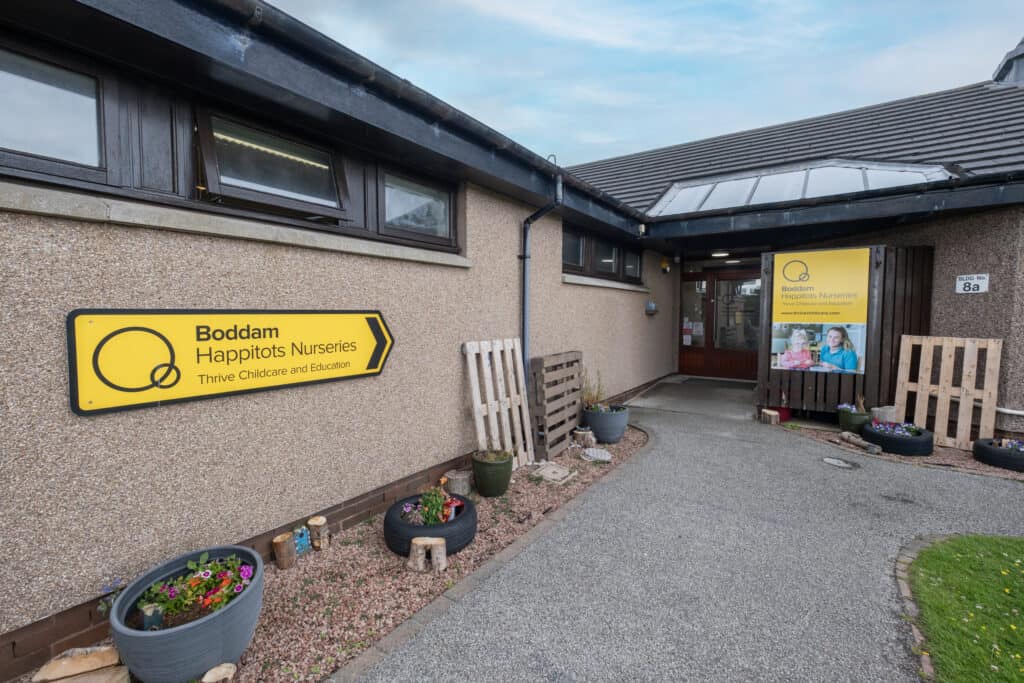 Bright entrance of Boddam Happitots Nurseries with welcoming signage, outdoor plants, and clear childcare branding, highlighting trusted early childhood education services in Boddam.