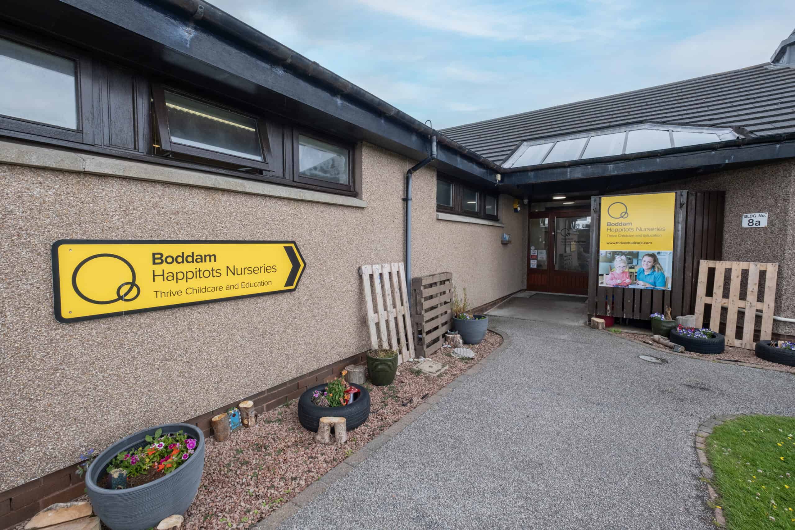 Bright entrance of Boddam Happitots Nurseries with welcoming signage, outdoor plants, and clear childcare branding, highlighting trusted early childhood education services in Boddam.
