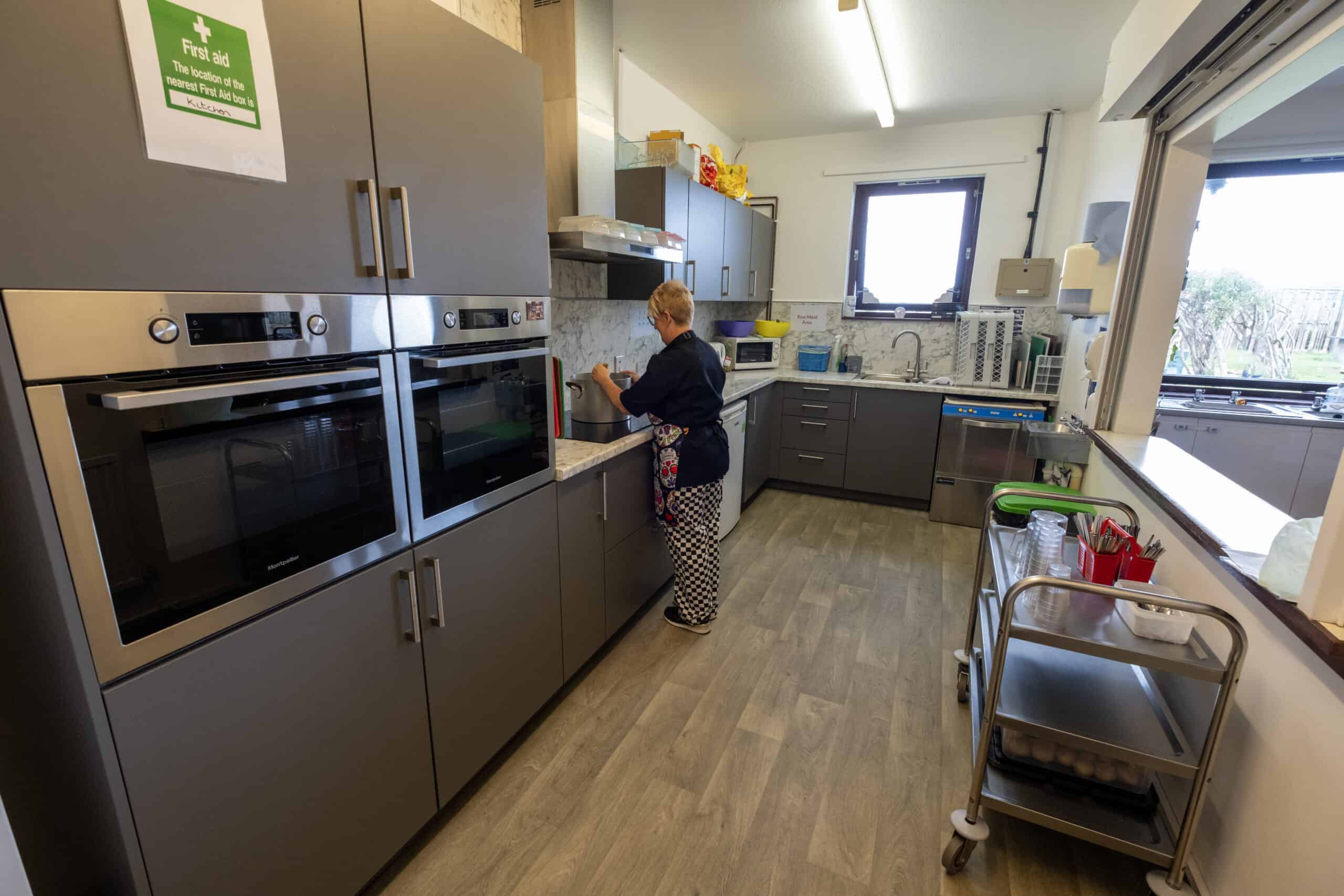 1. Modern childcare kitchen at Thrive Childcare with child-friendly appliances for cooking activities and meals.
