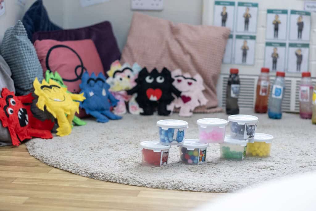Colourful sensory toys and plush characters in a childcare environment for early childhood development at Thrive Childcare in the UK.