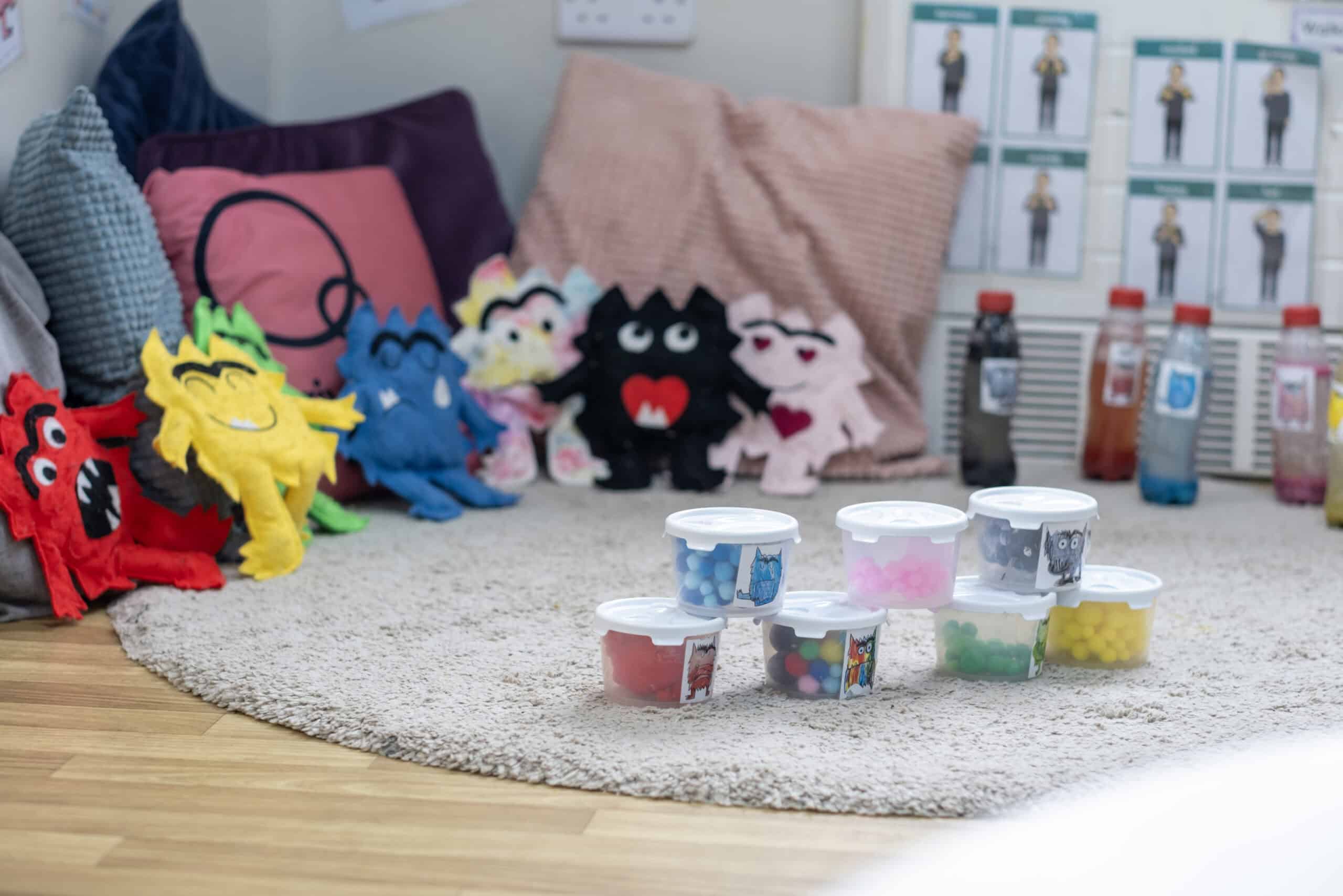 Colourful sensory toys and plush characters in a childcare environment for early childhood development at Thrive Childcare in the UK.