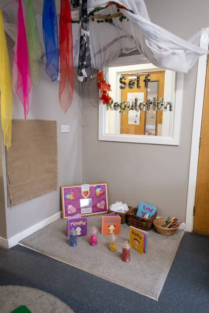 Bright colourful tissue paper decorations at Thrive Childcare's self-regulation area, promoting mindfulness and emotional well-being for children.