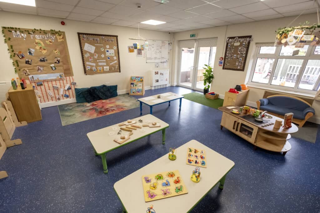 Bright, welcoming childcare playroom with age-appropriate toys, learning areas, and cosy seating, designed for early childhood development at Thrive Childcare in the UK.