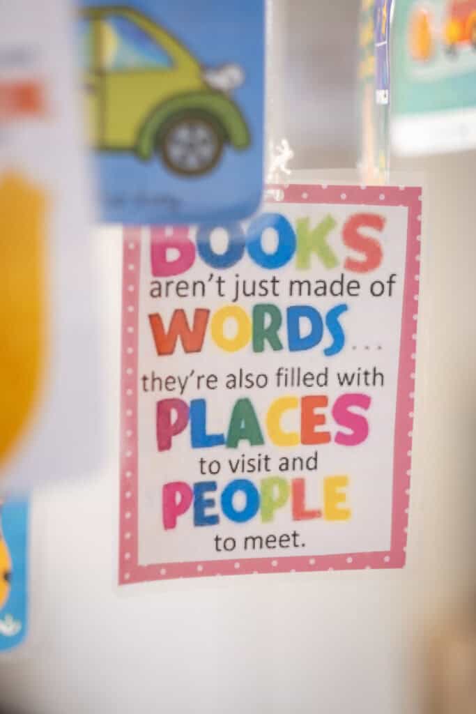 Colourful poster with the message "Books aren’t just made of words... they’re also filled with places to visit and people to meet" at Thrive Childcare, promoting early childhood learning, literacy, and imagination.
