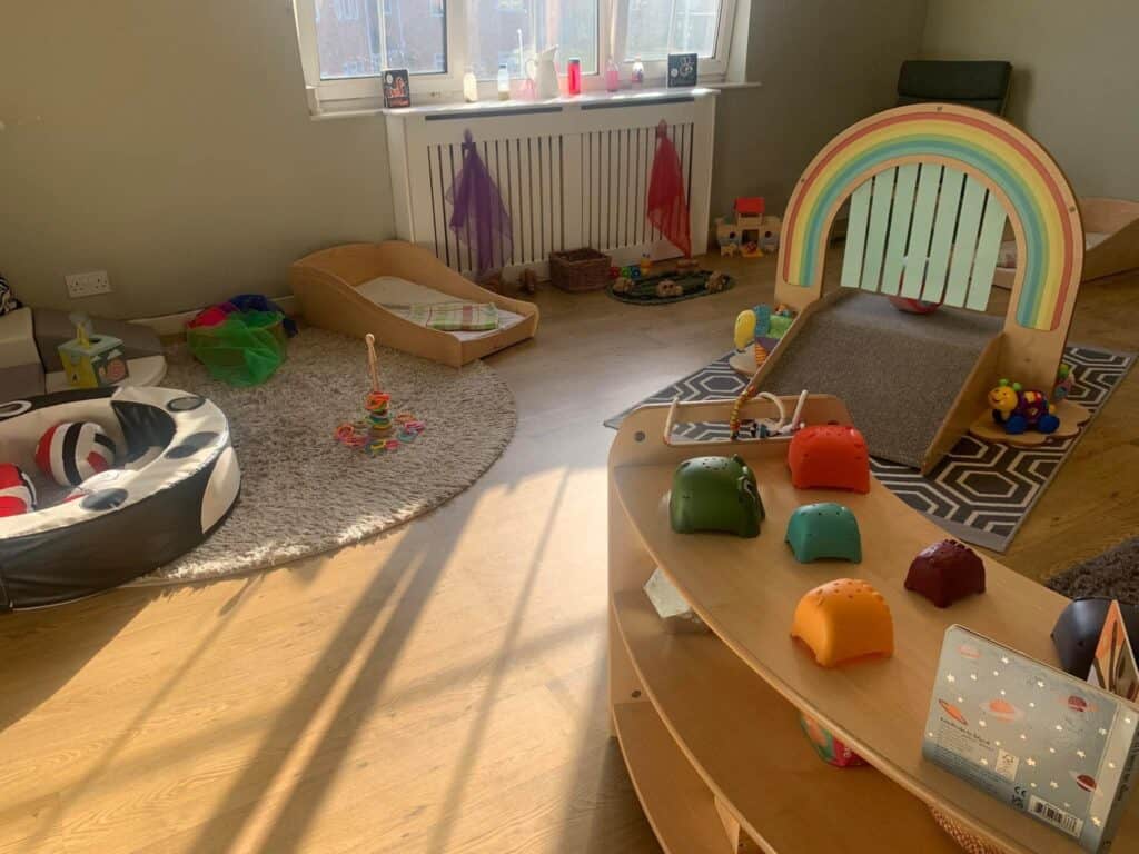 Bright indoor childcare play area at Thrive Childcare with colourful toys, soft play equipment, and cozy spaces designed for young children’s learning and development.