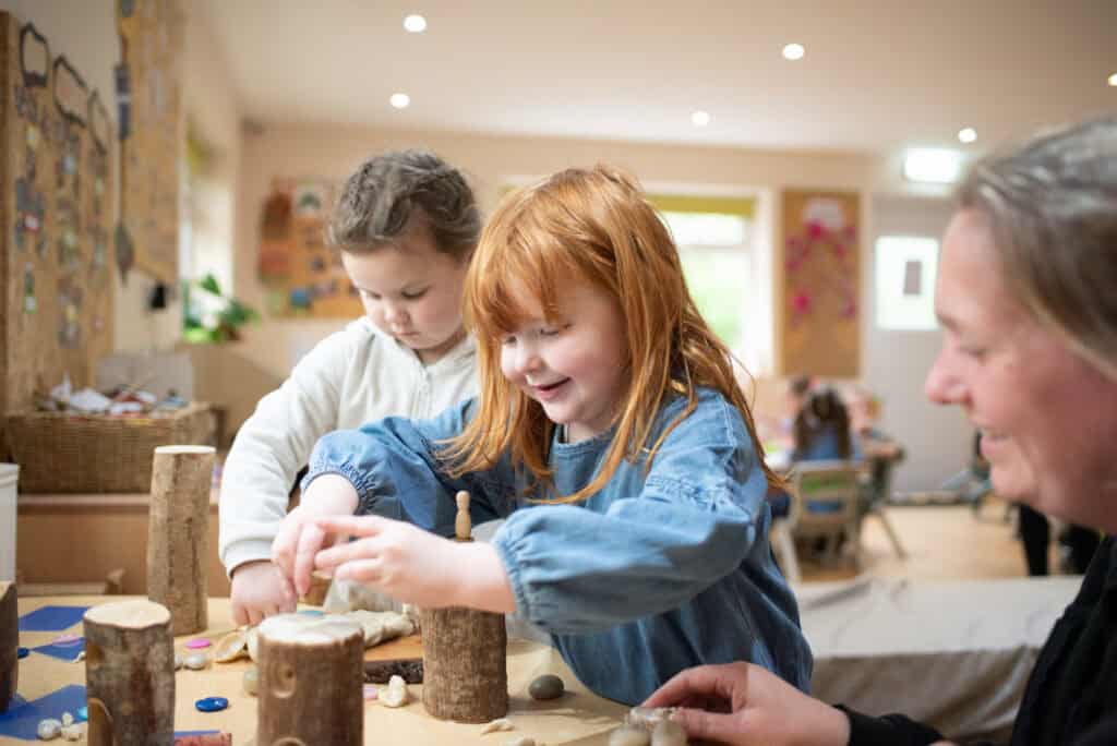 Playing and learning at Thrive Childcare with children engaging in creative activities in a warm, caring environment.