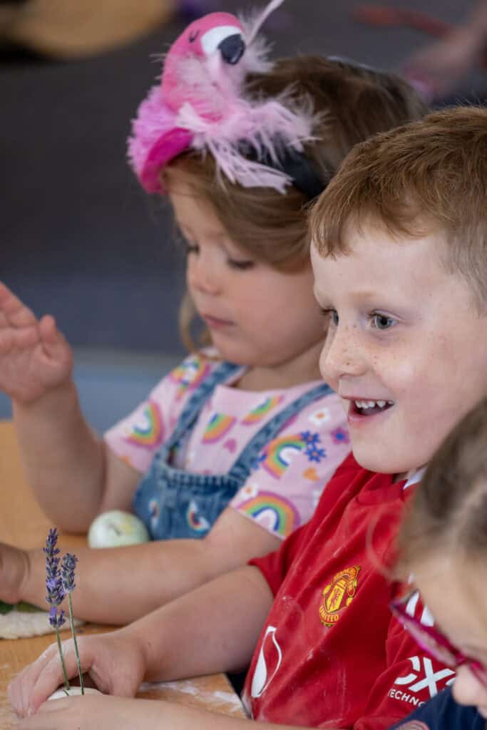 1. Childcare classroom with children engaging in creative activities at Thrive Childcare centre in the UK.