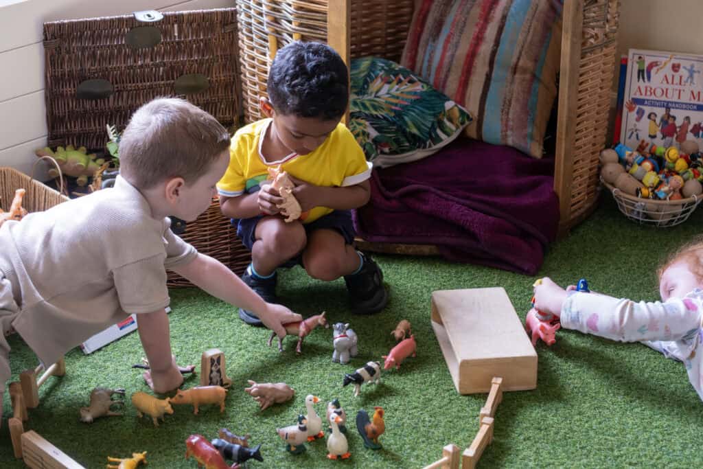 Vibrant toddler play area at Thrive Childcare featuring imaginative toy farm animals and interactive activities fostering early development and social skills.
