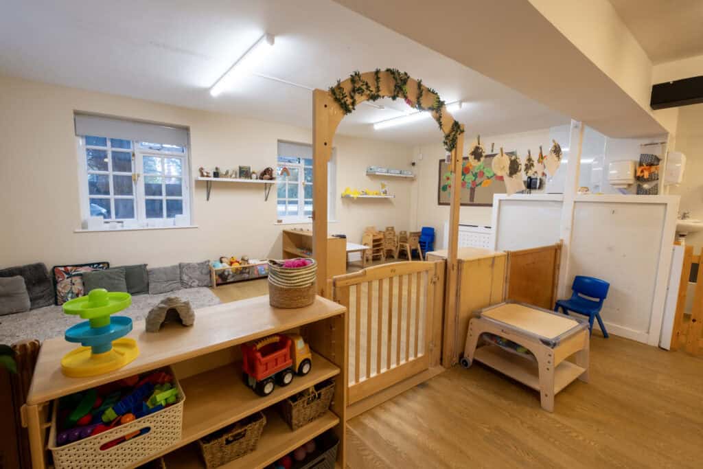 Bright indoor childcare play area at Thrive Childcare with colourful toys, cosy seating, and engaging activities for early childhood development.