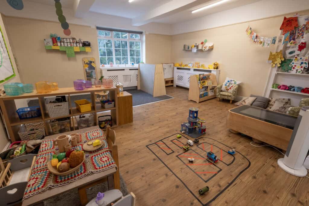 Bright, welcoming children's playroom at Thrive Childcare, featuring educational toys, reading nooks, and interactive play areas for early childhood development and learning.
