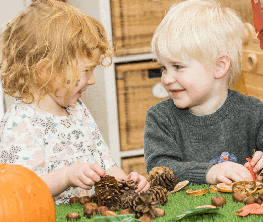 Bright young children enjoying a creative activity at Thrive Childcare, fostering social skills and early development in a nurturing environment.